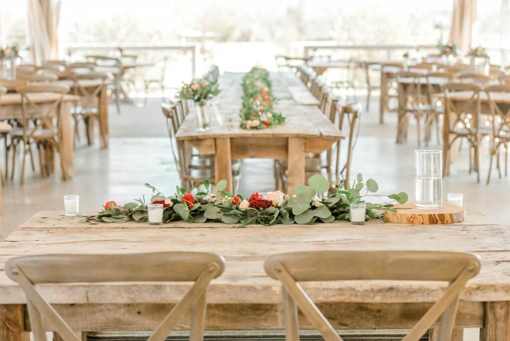 Gruene Texas Wedding Venue with rustic tables and floral centerpiece
